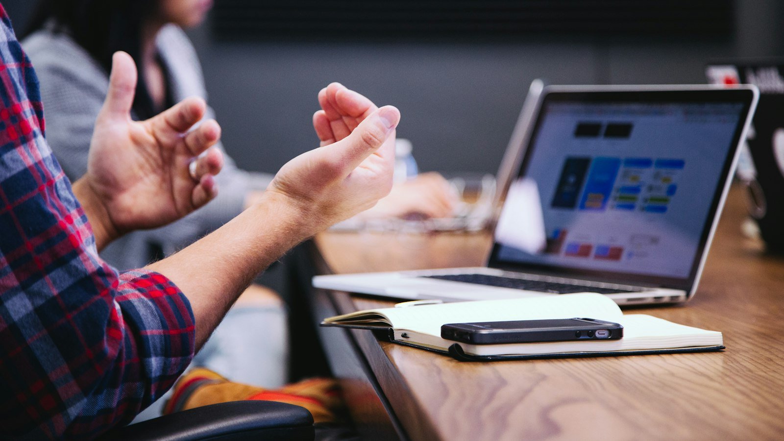 Marketing strategy conversation with a client over a laptop